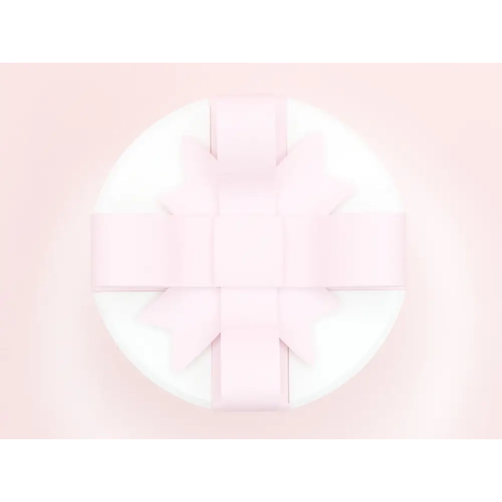 Creative bowknot pink and white valentine day gift box featuring a delicate pink ribbon bow on a smooth white surface