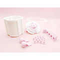White plastic modular shelving system with pink ribbon bow accents and circular cutouts for valentine day gift display