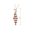 Gold-toned creative crystal peacock bridal necklace with colorful teardrop gemstones and sparkling crystals on tail feathers