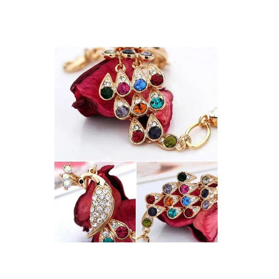 Gold-toned crystal peacock bridal bracelet with colorful teardrop rhinestones in red blue green and purple hues