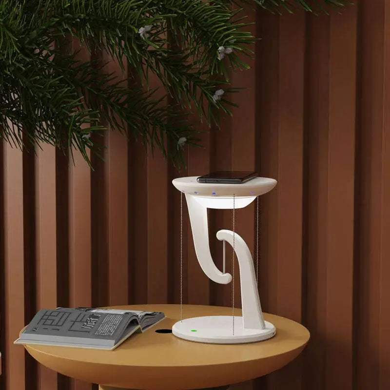 White modern charger suspension lamp with sleek curved design and blue led lights for smart wireless phone charging