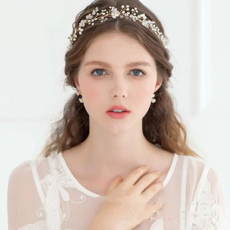 Delicate gold-toned crystal styling pearl headwear featuring clear crystals and pearl accents for elegant wedding styling
