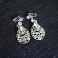 Silver teardrop clip-on earrings with clear crystals and openwork design from crystal bridal headdress flowers set