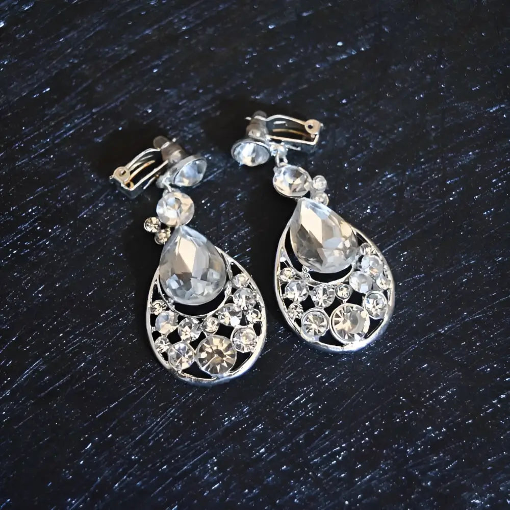 Silver teardrop clip-on earrings with clear crystals and openwork design from crystal bridal headdress flowers set