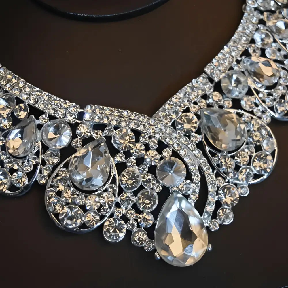 A sparkling silver crystal bridal headdress with clear teardrop and round crystals perfect for flowers wedding hair