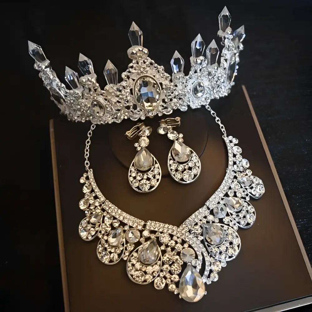Crystal bridal headdress flowers jewelry set featuring a silver tiara with clear crystals and matching earrings and necklace