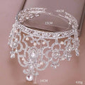 Silver ornate crystal crown catwalk tiara adorned with sparkling silver crystals and dangling pearls