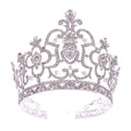 A sparkling silver crystal crown catwalk tiara with intricate pearl and crystal embellishments in silver