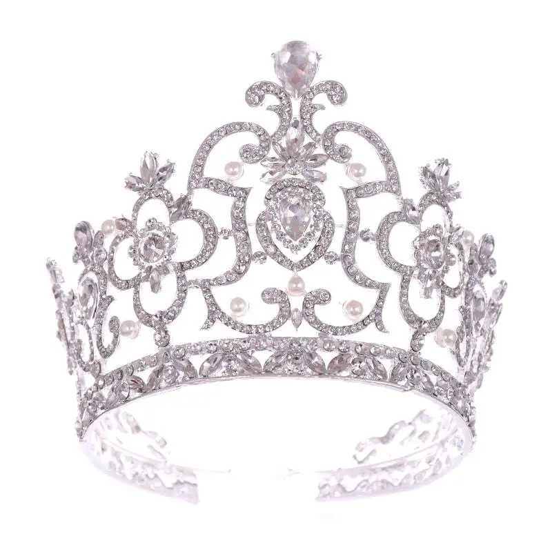 A sparkling silver crystal crown catwalk tiara with intricate pearl and crystal embellishments in silver