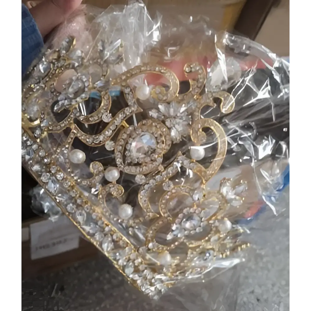 Gold-colored catwalk silver tiara adorned with sparkling silver crystal rhinestones pearls and intricate filigree detailing