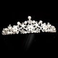A sparkling silver bridal headdress with intricate floral designs featuring clear crystals and white pearls from the crystal flower necklace set