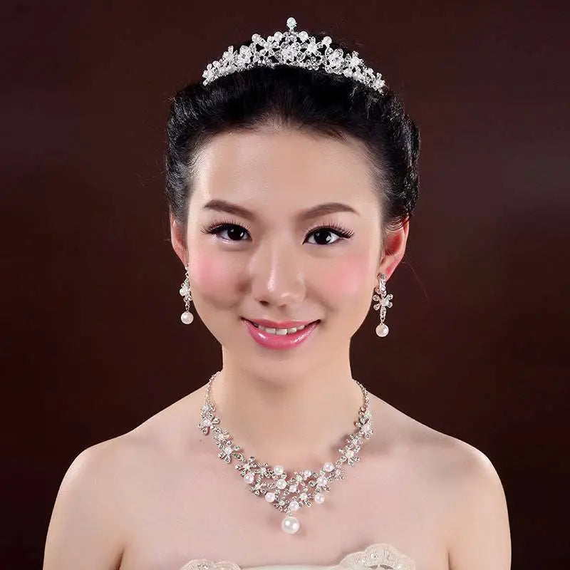 A sparkling silver bridal headdress with intricate crystal flower details from the crystal flower necklace set