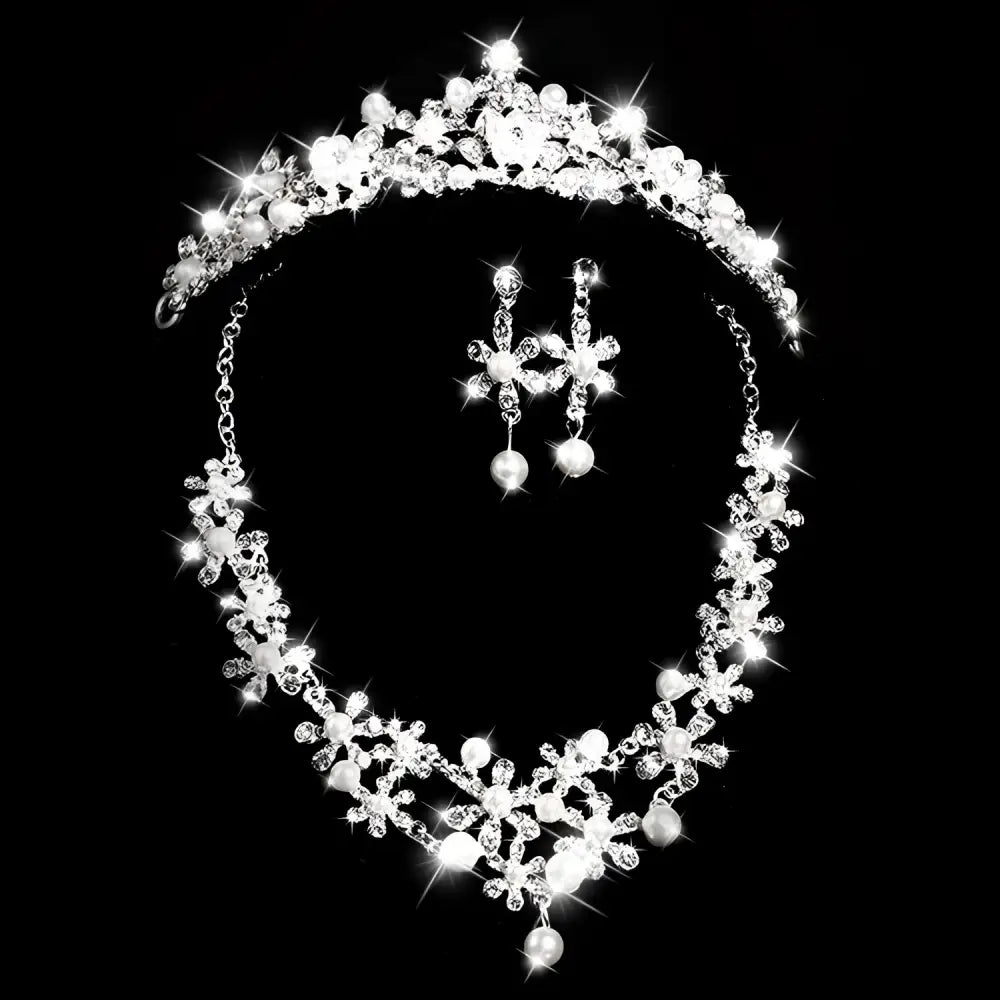 Sparkling silver bridal headdress set with clear crystals and pearls featuring a crystal flower necklace and earrings