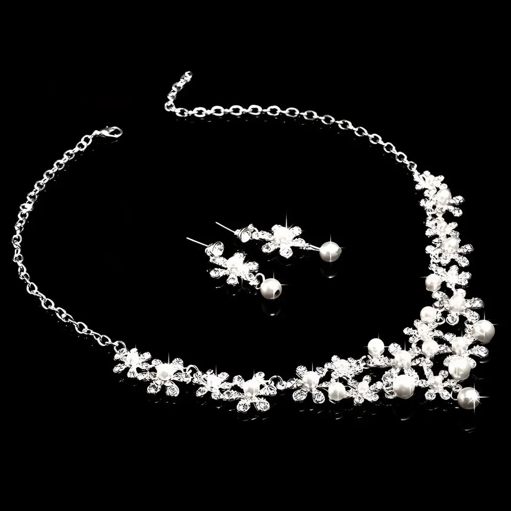 Silver crystal flower necklace adorned with sparkling crystals and white pearls for bridal use