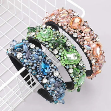 Three ornate black crystal geometric glass drill rhinestone headbands with vibrant blue green and peach beads