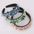 Three ornate black crystal geometric glass drill rhinestone headbands adorned with blue green and pink crystals