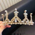 A golden crystal pearl girls princess crown headdress with sparkling crystals and white pearls in leaf design