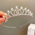A sparkling silver girls princess crown headdress with clear rhinestones and heart-shaped cutouts for crystal pearl girls
