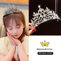 A sparkling silver rhinestone girls princess crown with leafy patterns and a central diamond crown headdress girls accessory