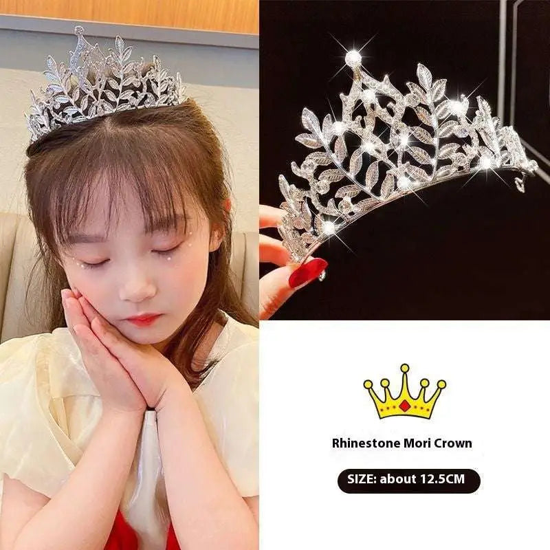 A sparkling silver rhinestone girls princess crown with leafy patterns and a central diamond crown headdress girls accessory