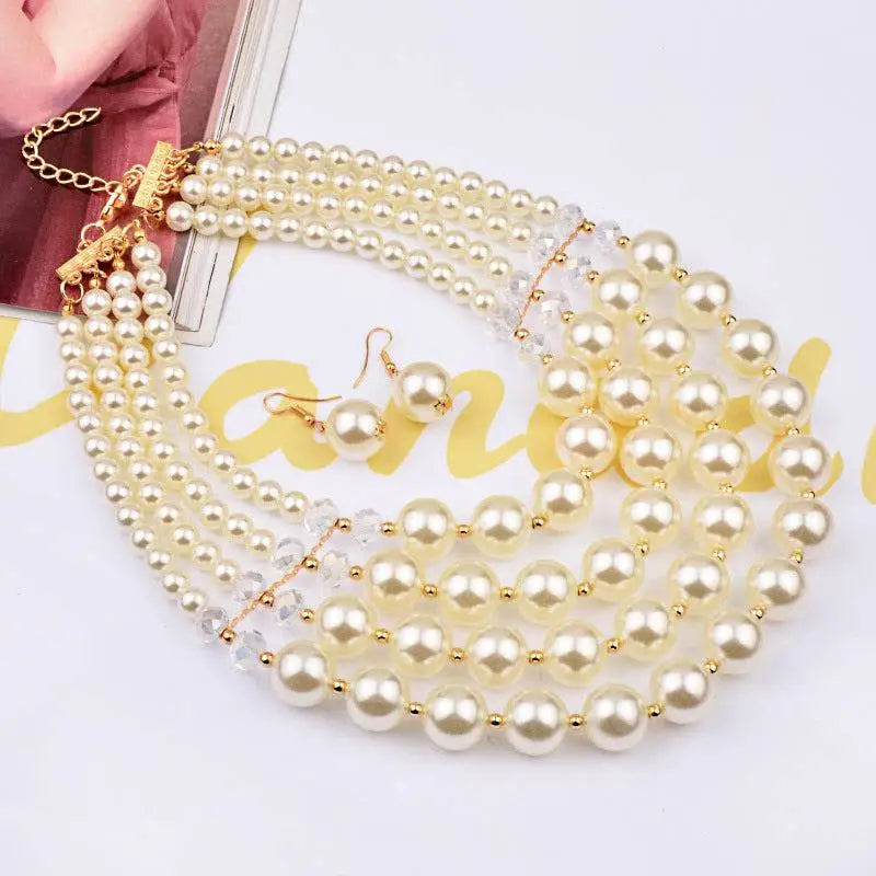 Elegant crystal pearl long necklace with gold-toned clasps and crystal accents paired with matching earrings set