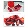 Red rose-themed elegant gift box featuring a crystal pendant necklace with glossy apple and rose ornaments symbolizing everlasting love