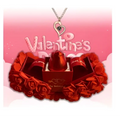 A shiny red lipstick in an elegant gift box with paper roses and a crystal pendant necklace symbolizing everlasting love