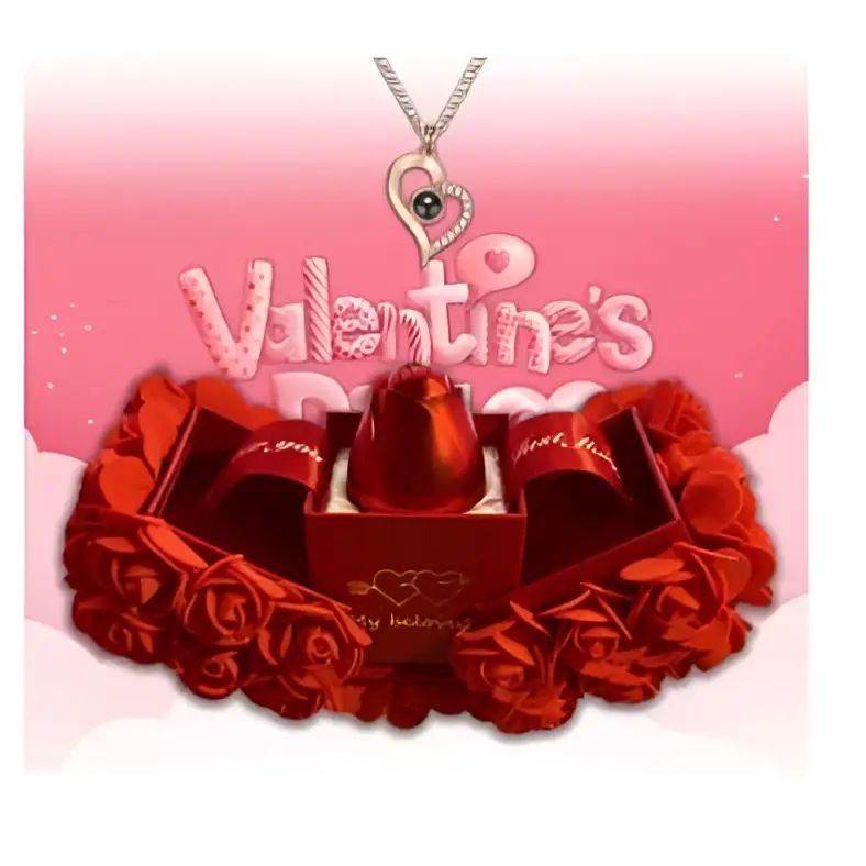 A shiny red lipstick in an elegant gift box with paper roses and a silver crystal pendant necklace symbolizing everlasting love