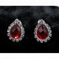 Elegant teardrop-shaped red customizable bride jewelry color diamond earrings set with clear crystal halo in silver-toned metal