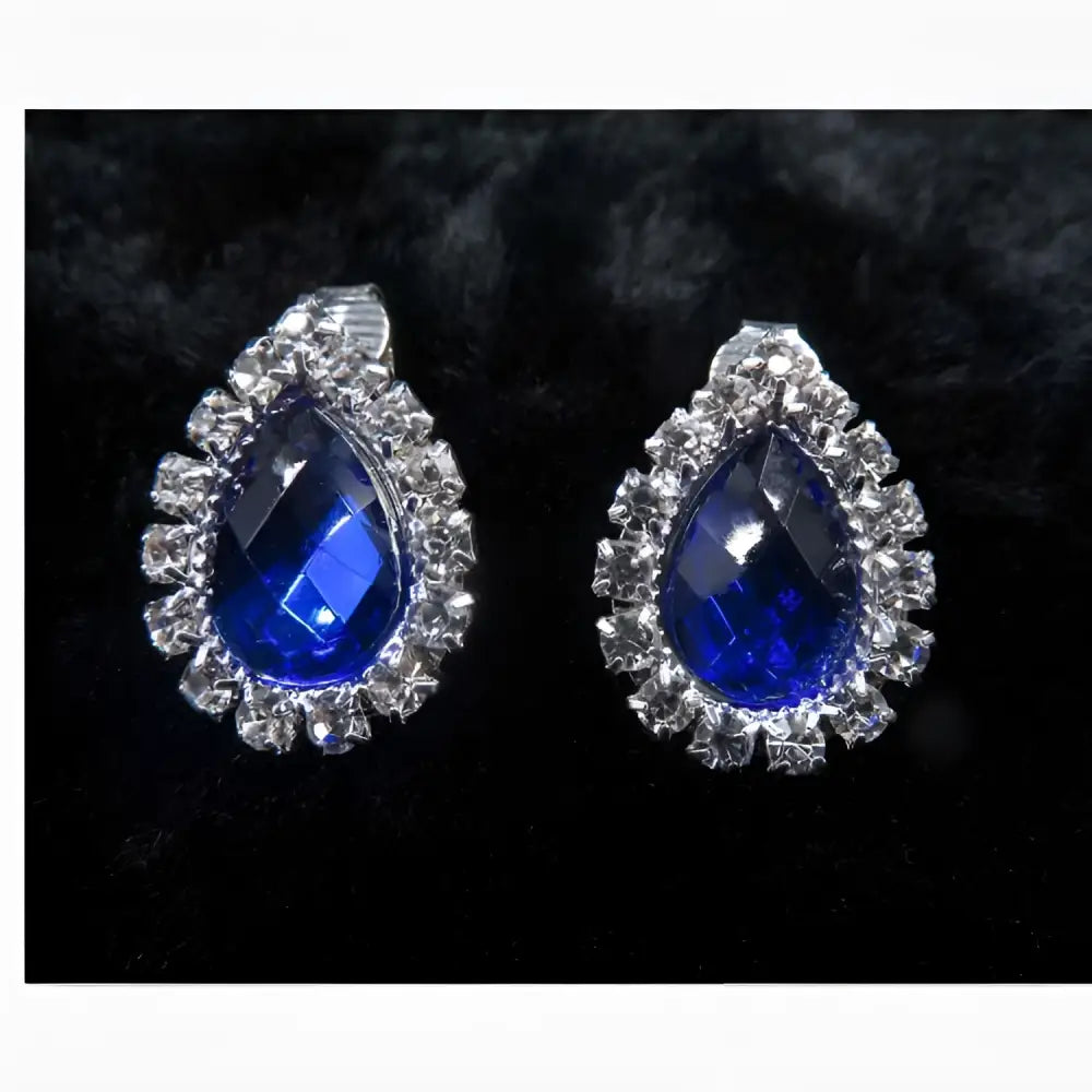 A pair of customizable bride jewelry color diamond earrings set with vibrant blue stones and clear crystals in silver