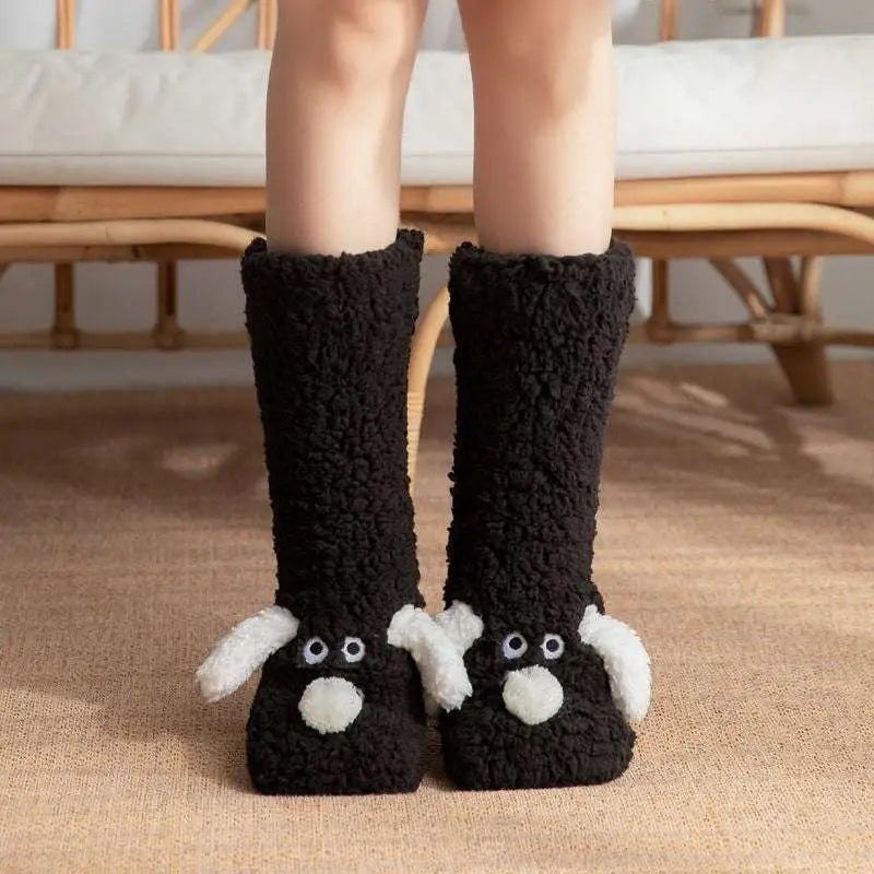 Black plush cute cartoon dog floor socks with white ears and nose details designed for indoor comfort