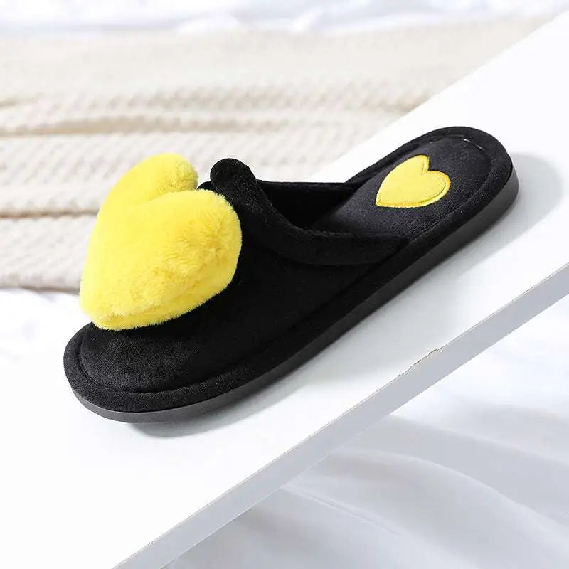 Black fuzzy cute love slipper with large yellow pom-pom heart and smaller embroidered heart winter warm plush design