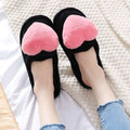 Black heart-shaped plush slippers with pink fuzzy accents for winter warm plush cute love slipper use at home