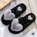 Black plush home slippers with plush gray heart decorations and stitched silver hearts for winter warm plush use