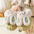 Cute white fluffy bunny shoes with light green soles and embroidered pink noses perfect as winter fuzzy slippers