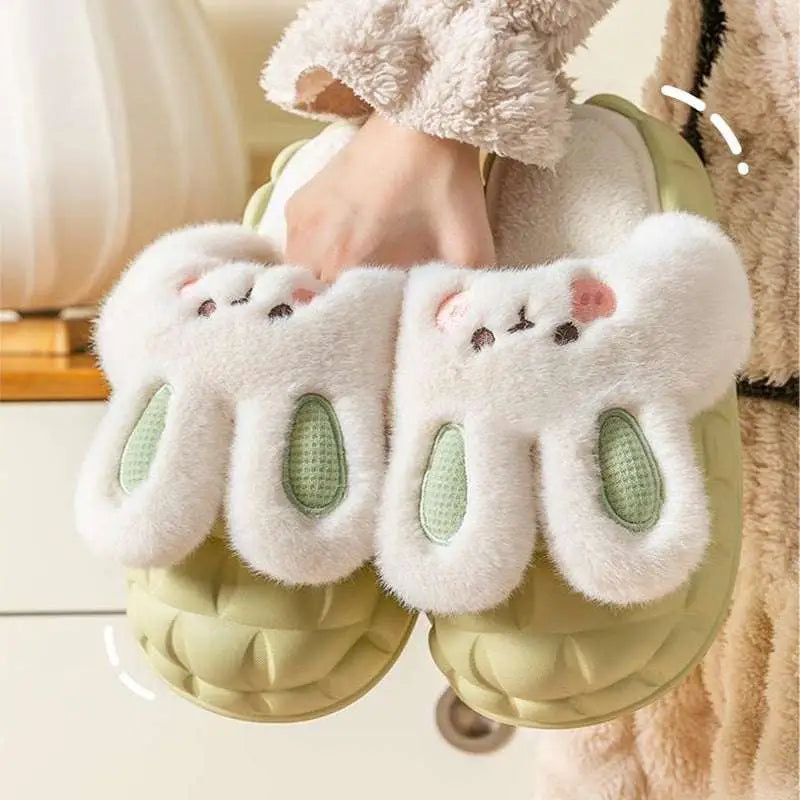 Cute white fluffy bunny shoes with light green soles and embroidered pink noses perfect as winter fuzzy slippers