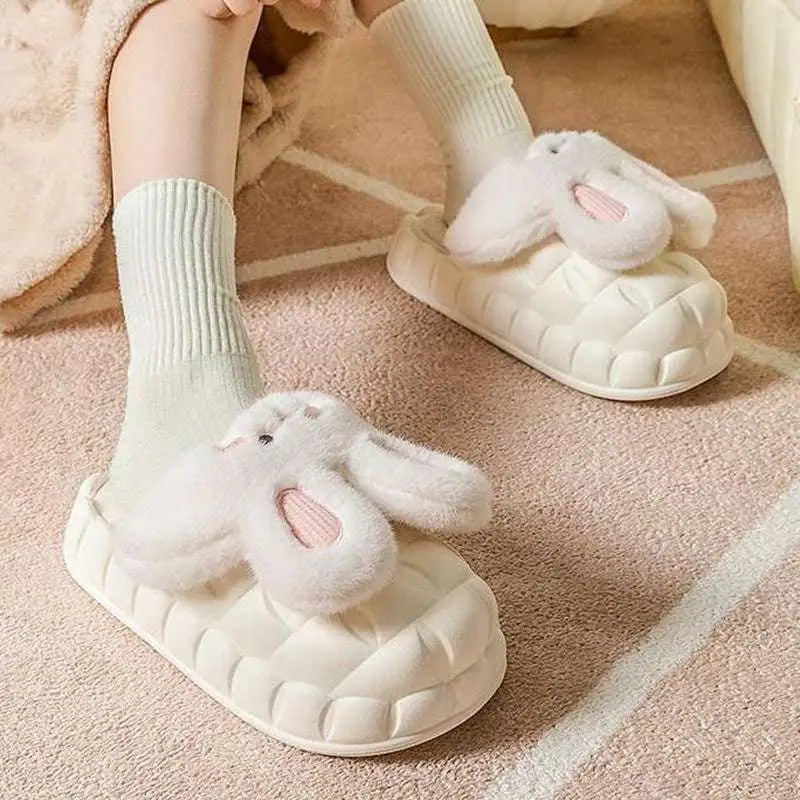 Cream-colored cute rabbit shoes with plush fluffy ears and pink inner details perfect as winter fuzzy slippers