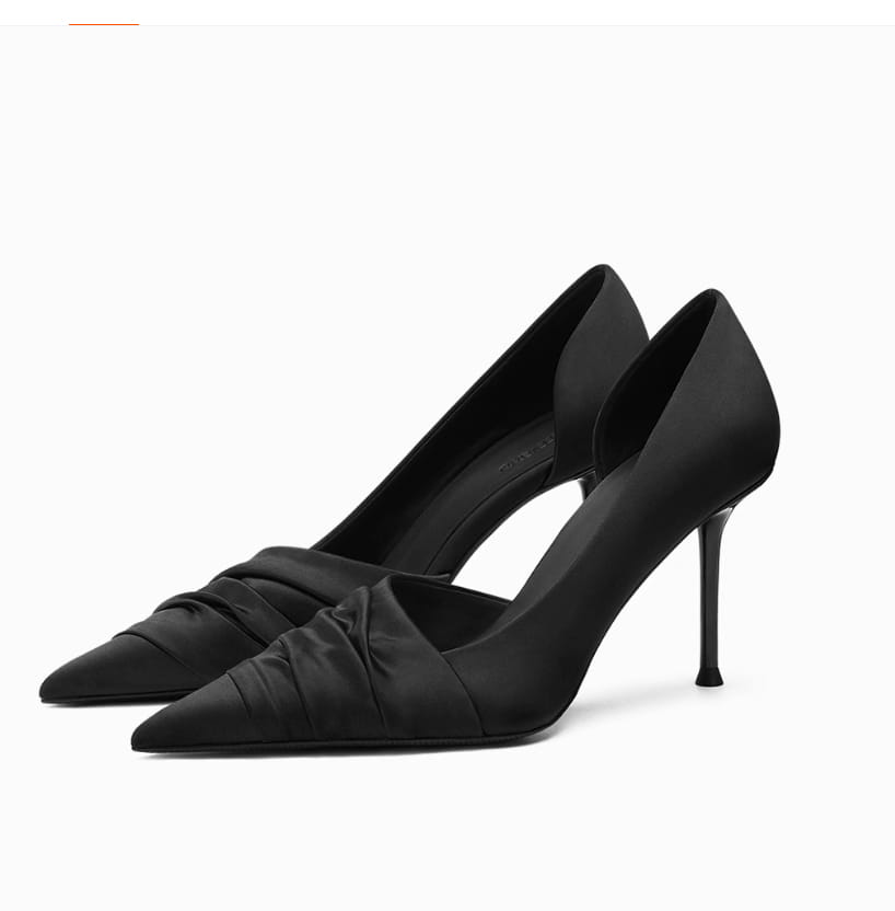 Ruched black cloth satin pointed high heels featuring elegant ruched detailing and a sleek design of empty high heels.