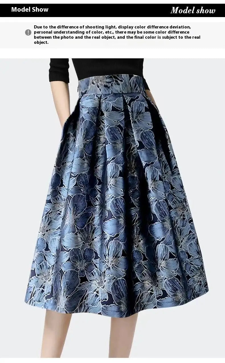 a high waist slimming jacquard floral midi skirt featuring a flared design with a blue floral pattern and black side panels in textured fabric