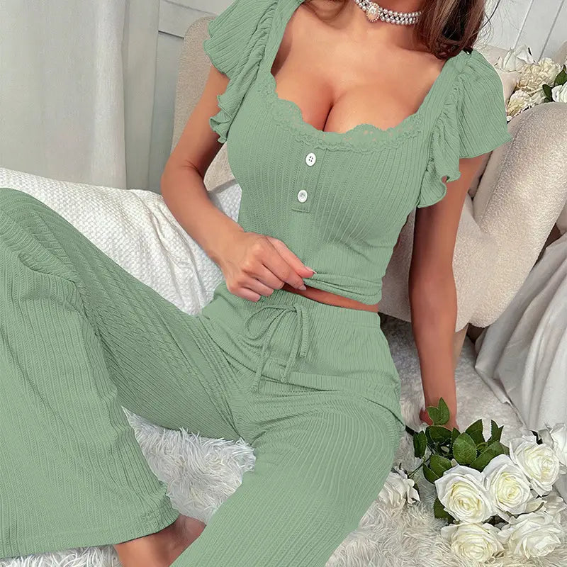 Black ribbed lace ruffle sleeve pajama set featuring a mint green ribbed knit two-piece set with ruffled short sleeves and a square neckline.