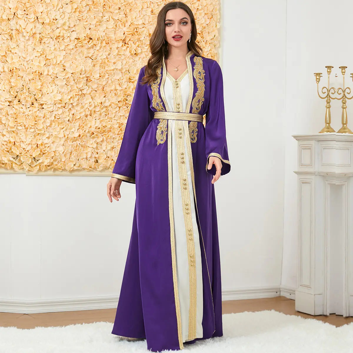 Purple and cream-colored embroidered moroccan-style abaya with gold thread detailing along the front opening cuffs and waistband featured as a foreign trade dress.