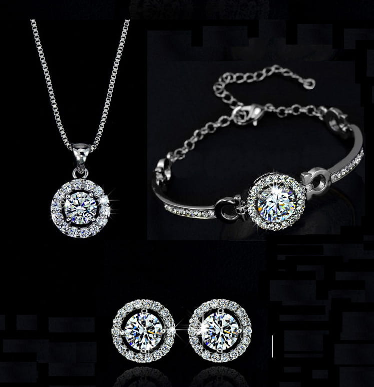 silver-toned jewelry sets featuring a necklace bracelet and earrings with sparkling round-cut stones in an elegant halo design for luxury women’s fashion.