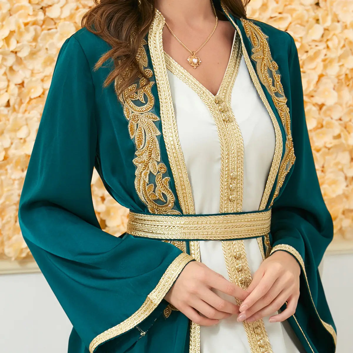 Teal velvet long sleeve djellaba featuring intricate gold embroidery and a matching belt as part of a foreign trade dress collection.