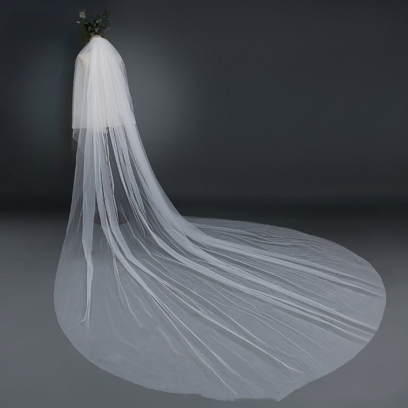 a flowing translucent white bridal wedding veil with a delicate layered design and an elegant soft drape featuring a widened tail for a wedding veil widened effect