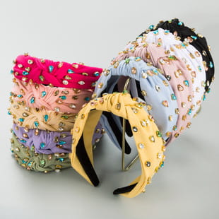 A vibrant baroque vintage court style crystal headband featuring a wide elastic band adorned with sparkling rhinestones and a soft fabric texture.