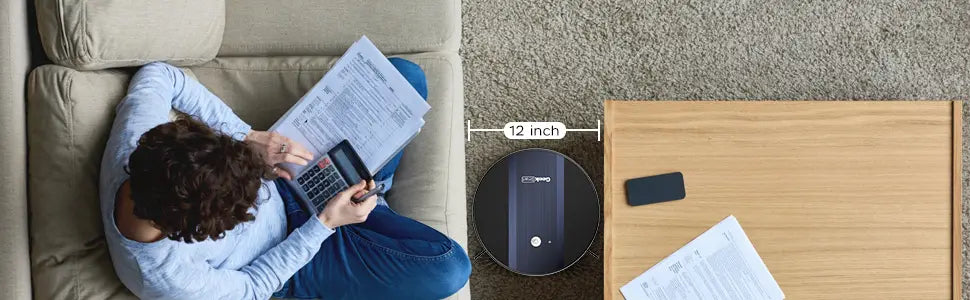 Black circular geek smart robot vacuum with strong suction, matte finish, central button, and 12 inches diameter.