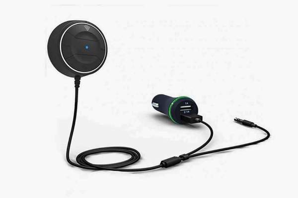 Black circular car hands free phone adapter with dual USB ports and blue LED indicator designed for hands free phone use and long press control in vehicles.