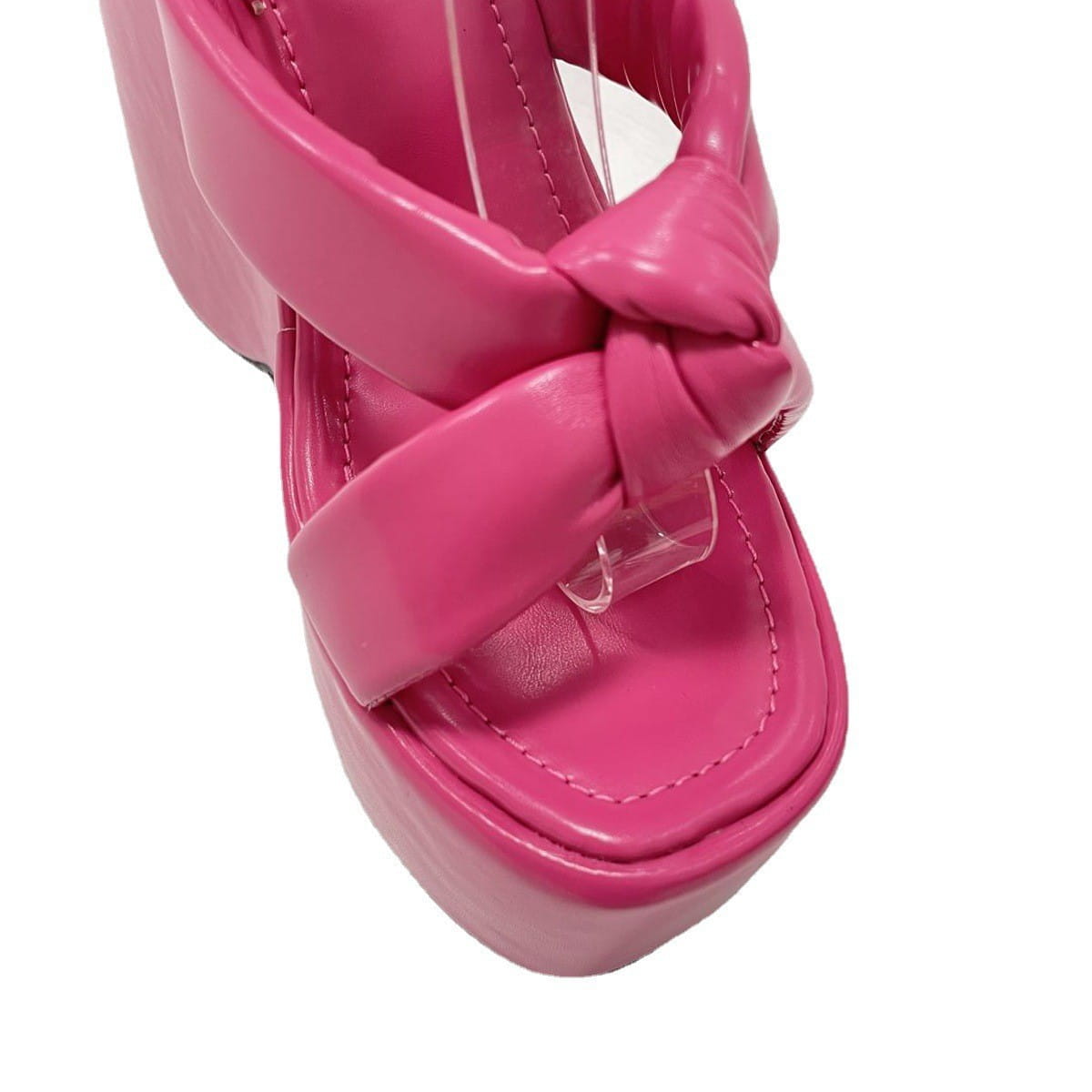 vibrant pink platform wedge high sandal with glossy patent leather finish and intricate knotted strap design