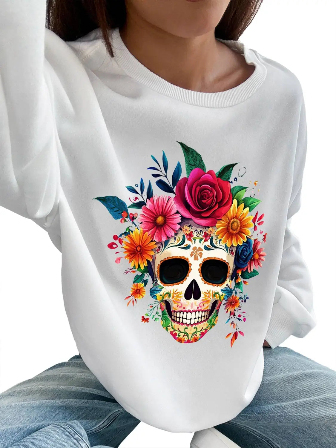 white basic long sleeve crew neck sweatshirt for daily wear featuring a vibrant colorful floral skull design with roses and blossoms in pink orange yellow and blue