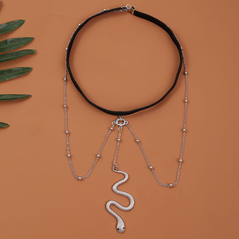 black choker necklace with a silver big snake pendant and beaded chains in bohemian boho gold style, complementing leg chain jewelry collections